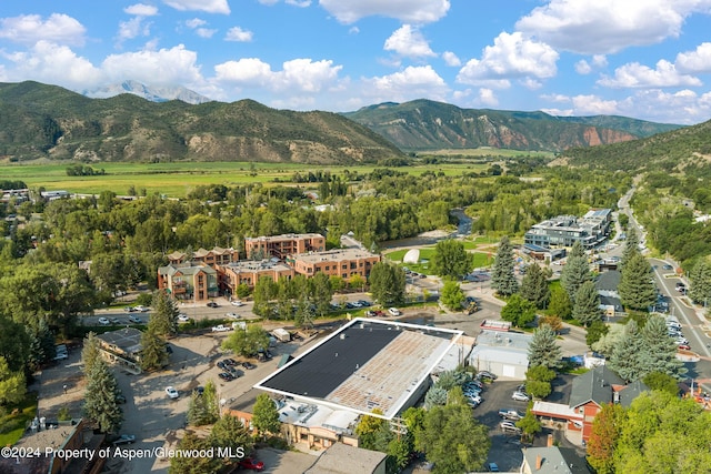 birds eye view of property with a mountain view