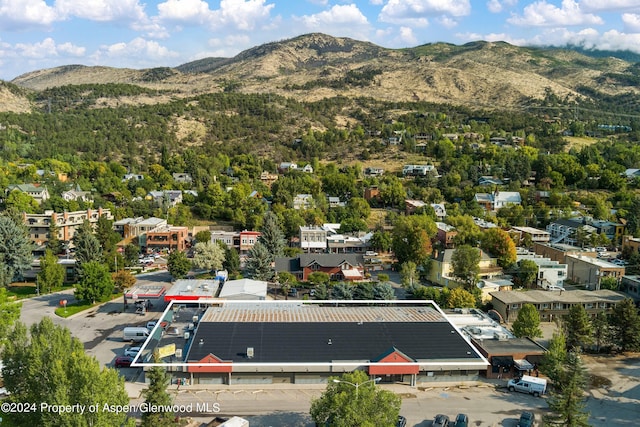 drone / aerial view featuring a mountain view