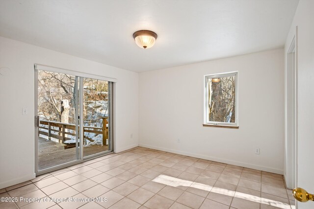 unfurnished living room featuring light hardwood / wood-style flooring, high vaulted ceiling, and an inviting chandelier