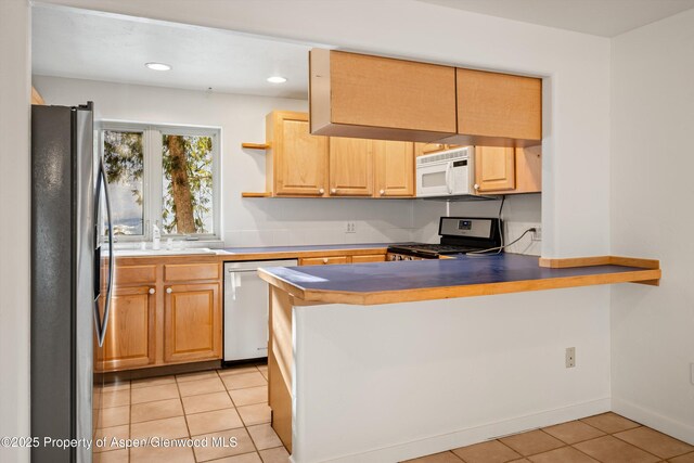 unfurnished room with plenty of natural light, high vaulted ceiling, light hardwood / wood-style flooring, and a notable chandelier