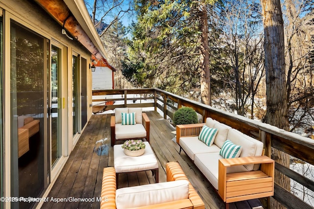 wooden terrace featuring outdoor lounge area