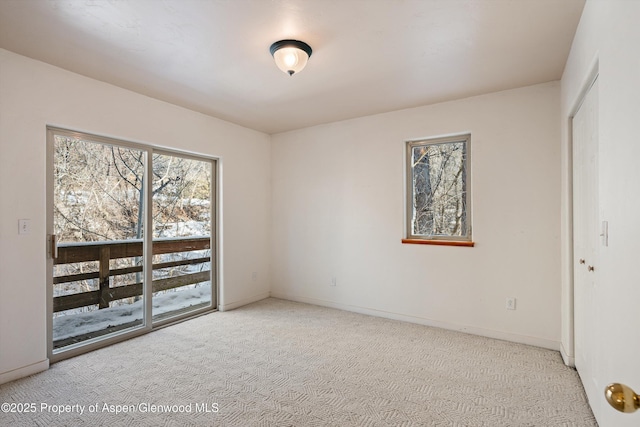 empty room featuring light colored carpet