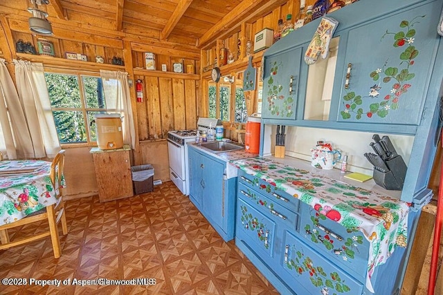 1136 Dipper Dr, Craig, CO 81625 - kitchen featuring wooden ceiling with exposed beams, white gas stove, and a sink