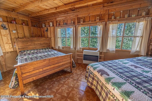 1136 Dipper Dr, Craig, CO 81625 - bedroom featuring multiple windows, wood ceiling with exposed beams, heating unit, wood walls, and a wall mounted AC