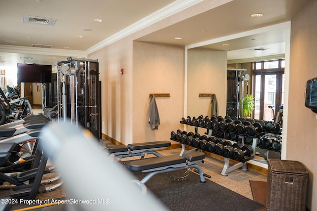 workout area with ornamental molding