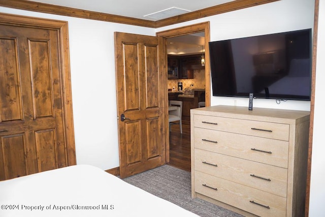 bedroom with ornamental molding