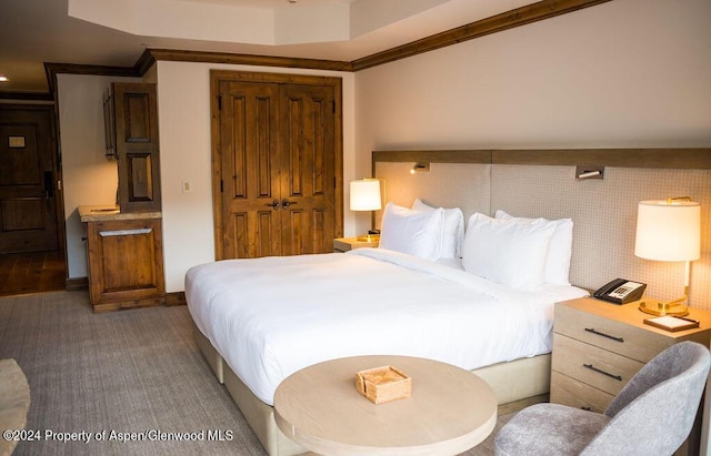 bedroom featuring a closet and ornamental molding