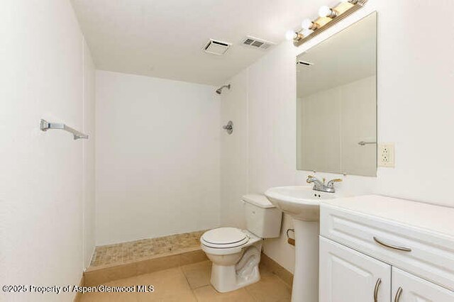 1608 Crawford Way, Glenwood Springs, CO 81601 - full bathroom featuring toilet, tile patterned flooring, a shower, and baseboards