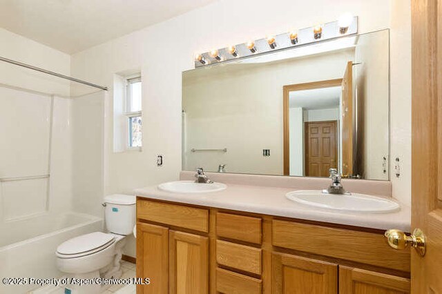 1608 Crawford Way, Glenwood Springs, CO 81601 - full bathroom with double vanity, toilet, and bathtub / shower combination