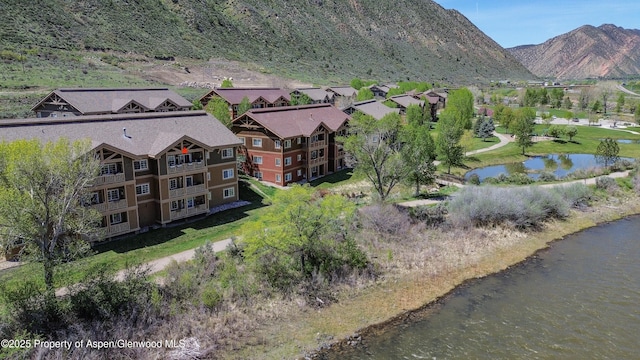 bird's eye view featuring a water and mountain view