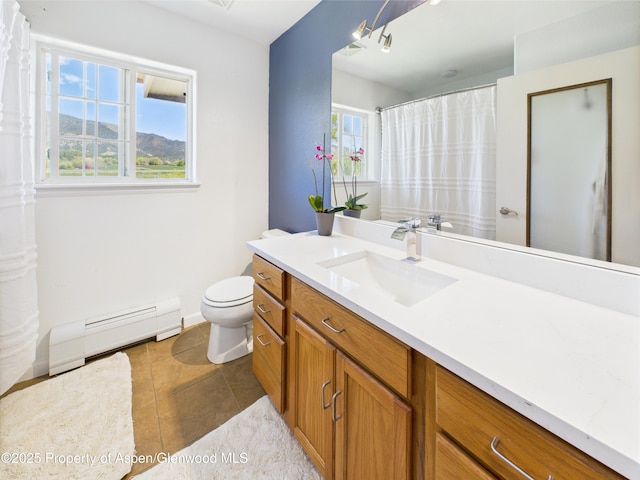 bathroom featuring a baseboard heating unit, tile patterned flooring, vanity, and toilet