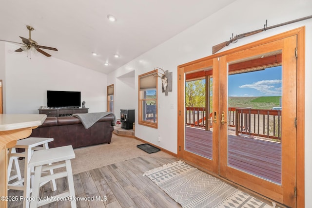 1600 County Road 30, Craig, CO 81625 - living area featuring light wood-style floors, french doors, vaulted ceiling, ceiling fan, and baseboards