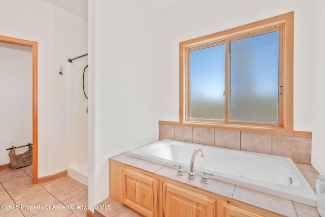 1600 County Road 30, Craig, CO 81625 - bathroom featuring a tub with jets, a shower, and tile patterned floors