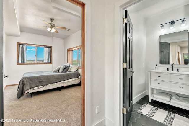 1600 County Road 30, Craig, CO 81625 - bedroom with a sink, baseboards, dark tile patterned flooring, and ceiling fan