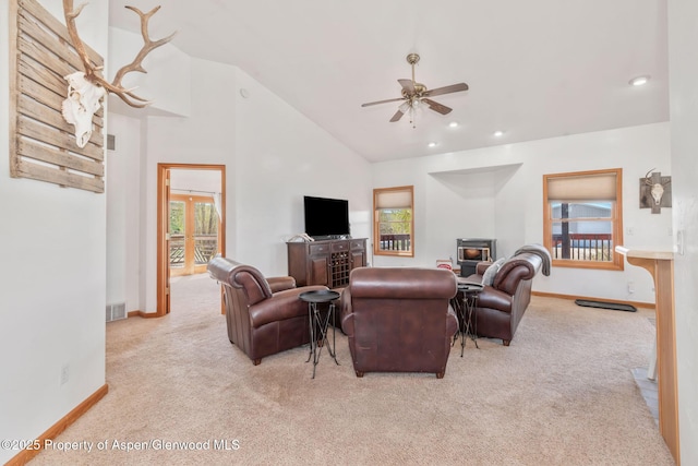 1600 County Road 30, Craig, CO 81625 - carpeted living room with a ceiling fan, a wood stove, baseboards, high vaulted ceiling, and recessed lighting