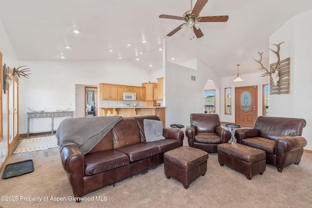 1600 County Road 30, Craig, CO 81625 - living area with a ceiling fan, high vaulted ceiling, light colored carpet, and recessed lighting