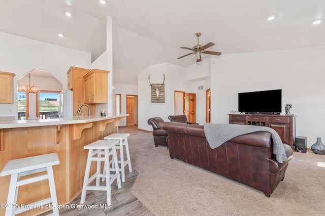 1600 County Road 30, Craig, CO 81625 - living room with ceiling fan, recessed lighting, light carpet, and high vaulted ceiling