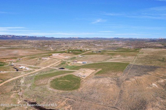 1600 County Road 30, Craig, CO 81625 - aerial view of property and surrounding area featuring a mountainous background and rural landscape