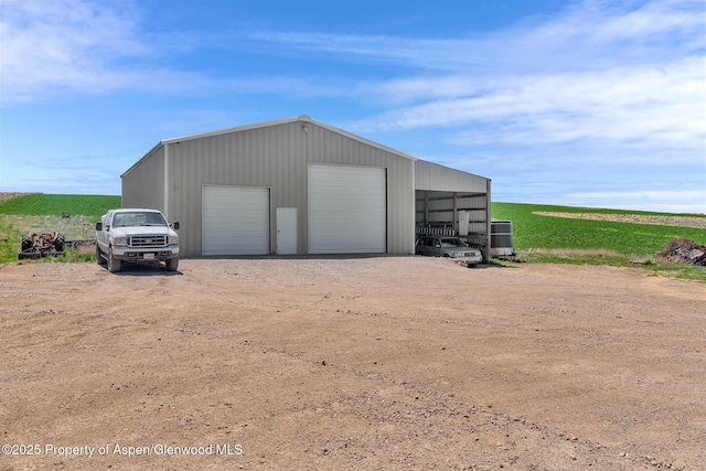 1600 County Road 30, Craig, CO 81625 - garage featuring a garage and driveway