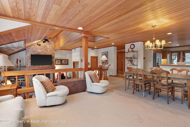 carpeted living room featuring lofted ceiling, wood ceiling, and a chandelier