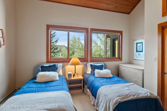 bedroom with vaulted ceiling, wooden ceiling, and baseboard heating