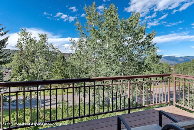 wooden terrace featuring a mountain view