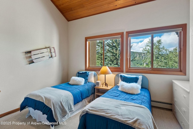 carpeted bedroom with vaulted ceiling, a baseboard heating unit, and wood ceiling