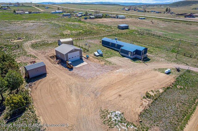 aerial view of sparsely populated area featuring a mountain backdrop