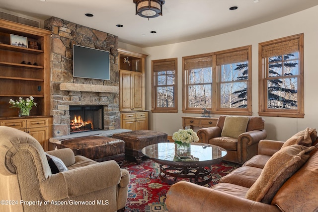 living room featuring a fireplace