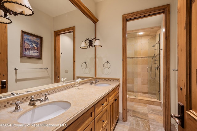 bathroom with decorative backsplash, vanity, and an enclosed shower