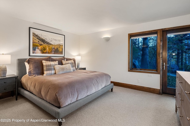 bedroom featuring light carpet