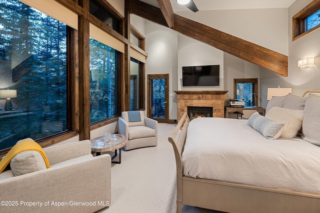 bedroom featuring beam ceiling and high vaulted ceiling