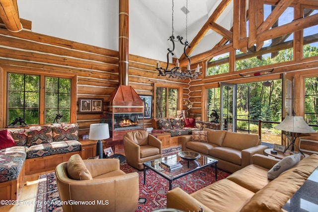 408 Gerbaz Way, Snowmass, CO 81654 - living room with log walls, high vaulted ceiling, and wood finished floors
