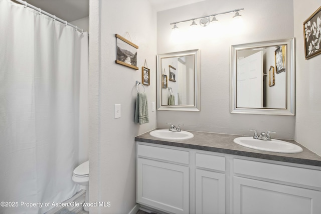 10 Spruce Ct, Parachute, CO 81635 - bathroom with double vanity and a shower with shower curtain