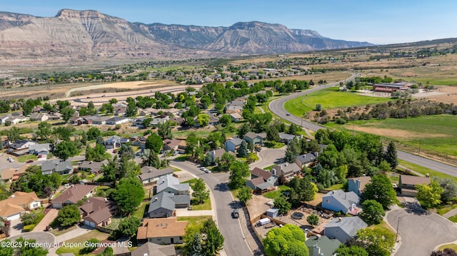 10 Spruce Ct, Parachute, CO 81635 - aerial view of property and surrounding area featuring nearby suburban area and a mountain backdrop