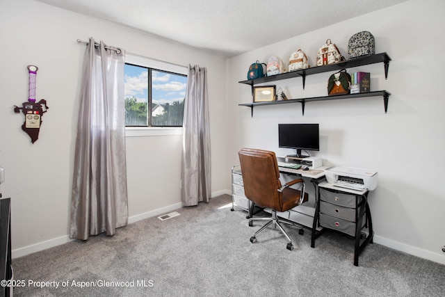 10 Spruce Ct, Parachute, CO 81635 - carpeted office space featuring a textured ceiling and baseboards