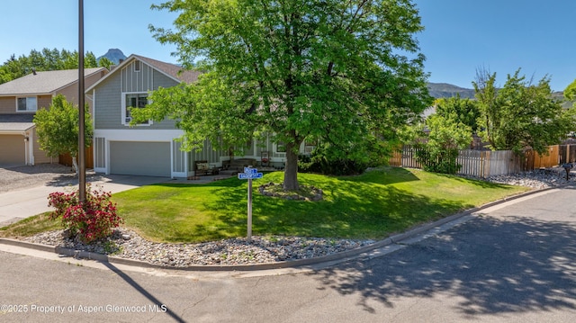 10 Spruce Ct, Parachute, CO 81635 - obstructed view of property with concrete driveway, board and batten siding, an attached garage, and a mountain view