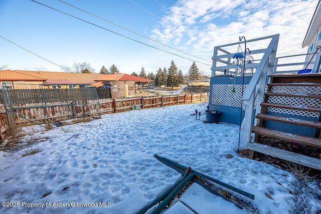 view of yard covered in snow