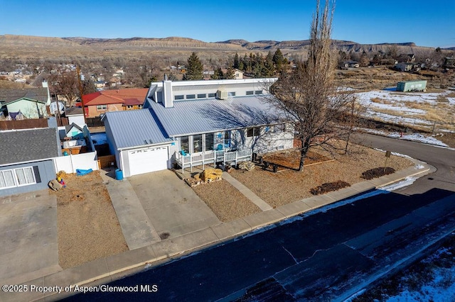 birds eye view of property featuring a mountain view