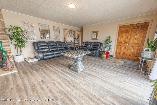 living room with ornamental molding