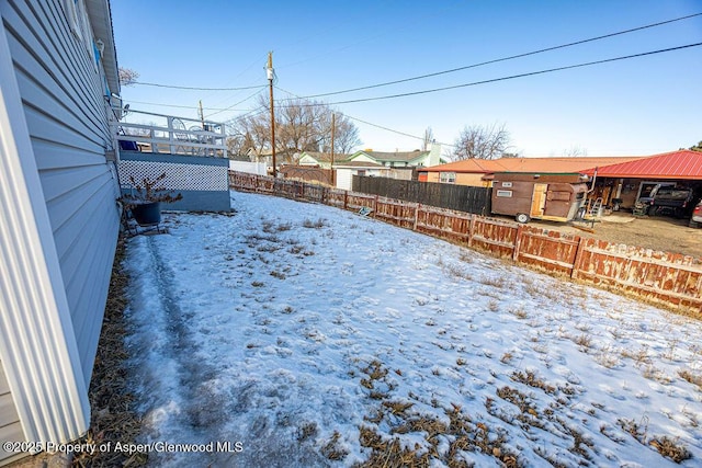 view of yard covered in snow