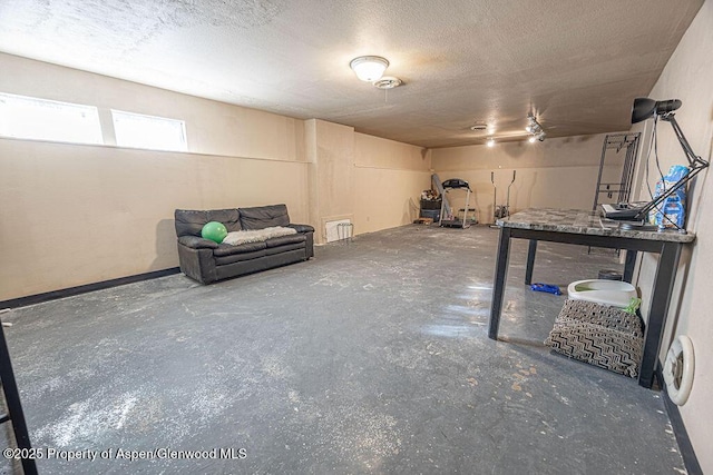 basement with a textured ceiling