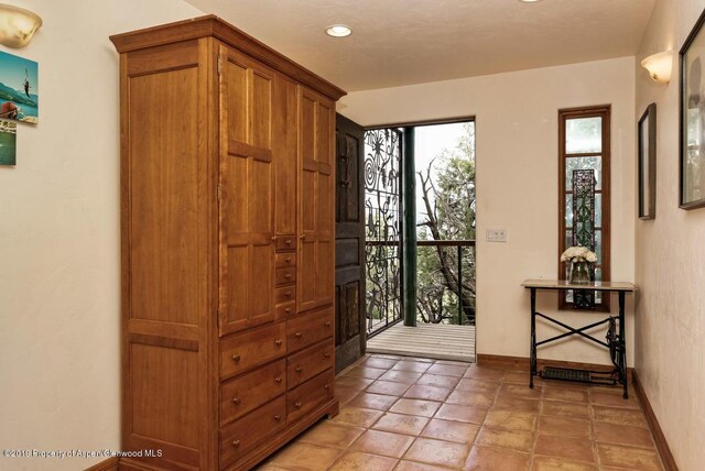 222 Crest Point Dr, Carbondale, CO 81623 - foyer entrance with light tile patterned floors