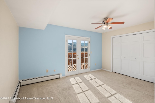 unfurnished bedroom with ceiling fan, french doors, light colored carpet, and a baseboard heating unit