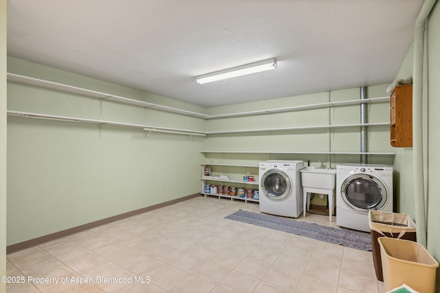 laundry area featuring washer and dryer and sink