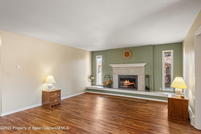 unfurnished living room featuring wood-type flooring