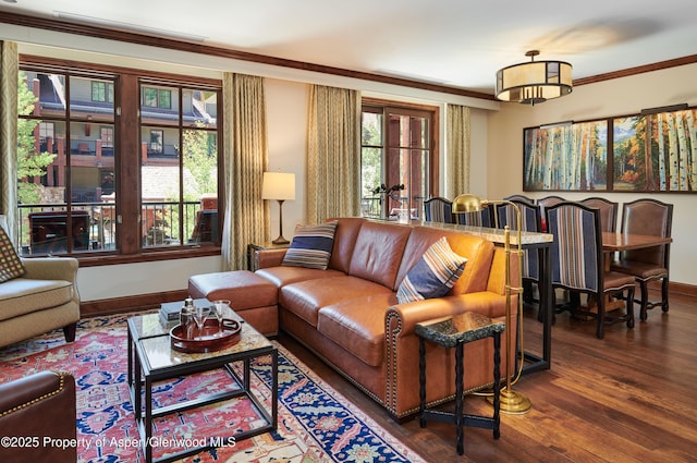 living room with crown molding and dark wood-type flooring