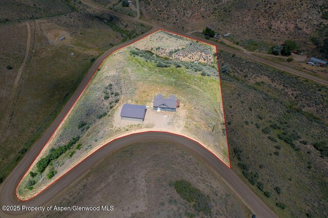 118 Highland Dr, Craig, CO 81625 - aerial overview of property's location featuring property parcel outlined and rural landscape