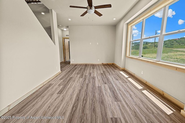 118 Highland Dr, Craig, CO 81625 - spare room with a ceiling fan, wood finished floors, and recessed lighting