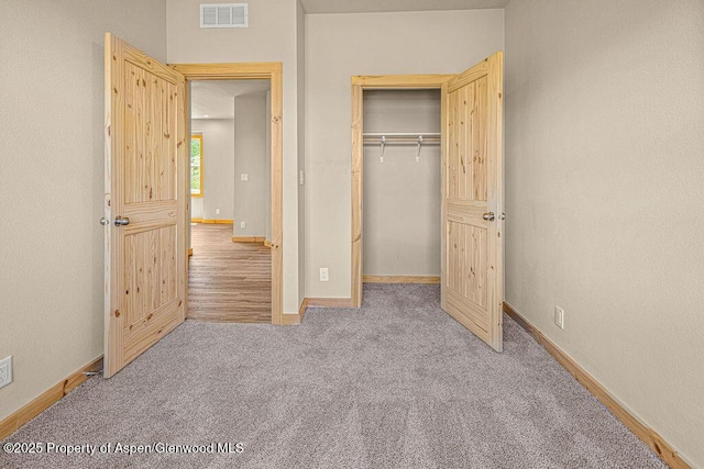 118 Highland Dr, Craig, CO 81625 - unfurnished bedroom featuring carpet floors and a closet